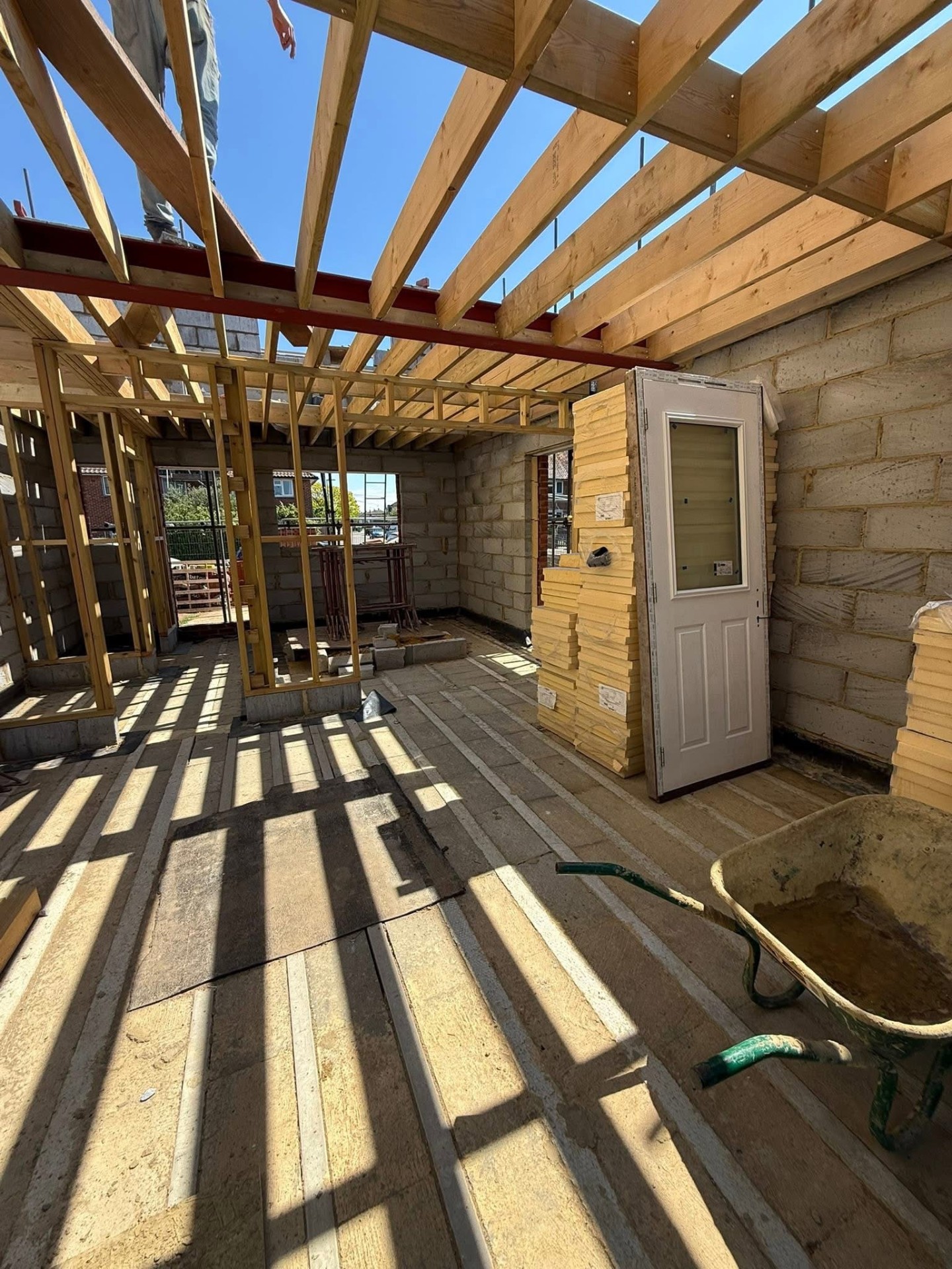 Interior view of new build timber roof structure and blockwork during construction by A Baker Construction West Sussex