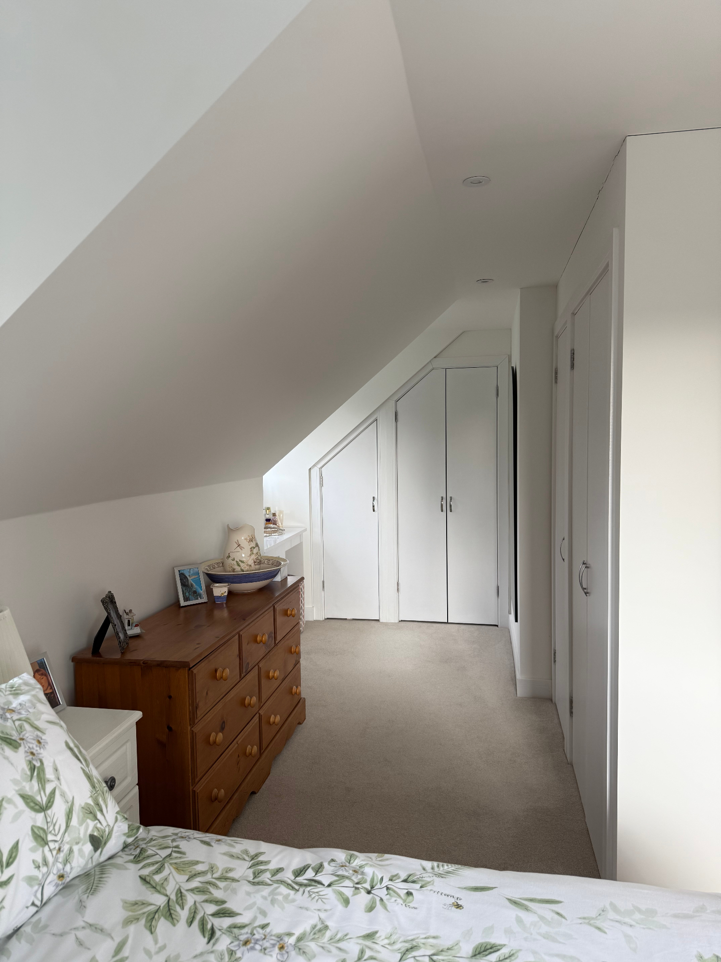 Finished loft bedroom with built in storage in a new build home by A Baker Construction West Sussex