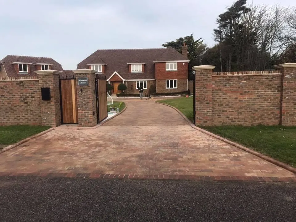 Block paved driveway with brick gate pillars completed by A Baker Construction West Sussex