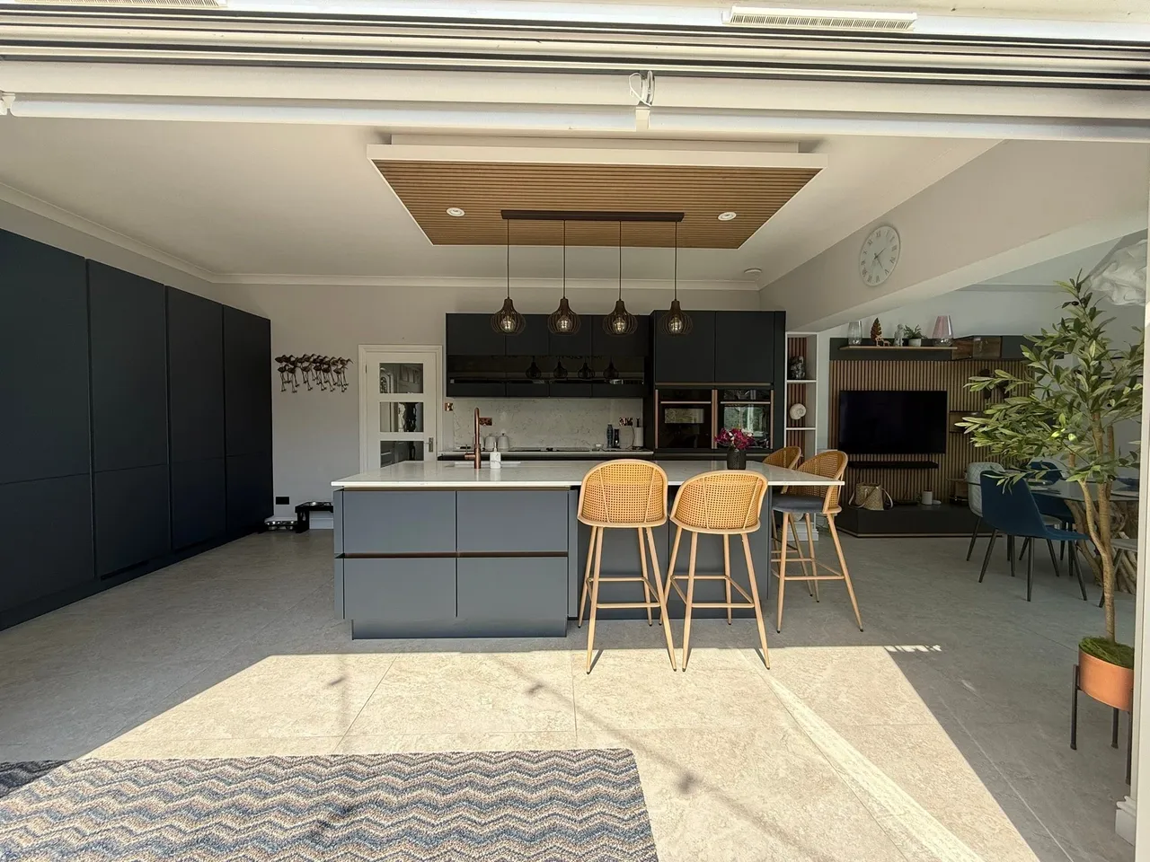 Premium open-plan kitchen extension with bi-fold doors completed in West Sussex
