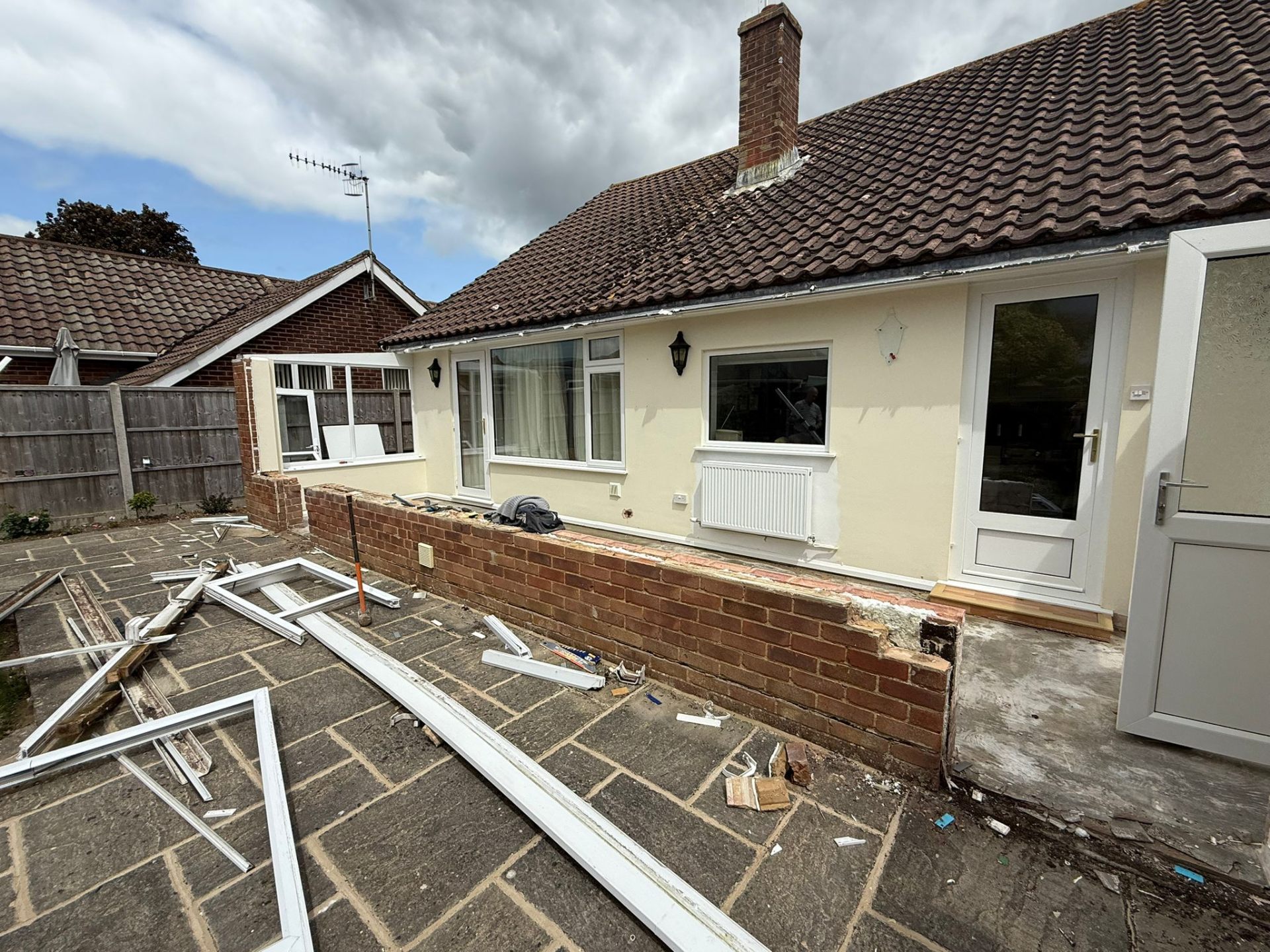 Finished living room with French doors to garden after extension West Sussex