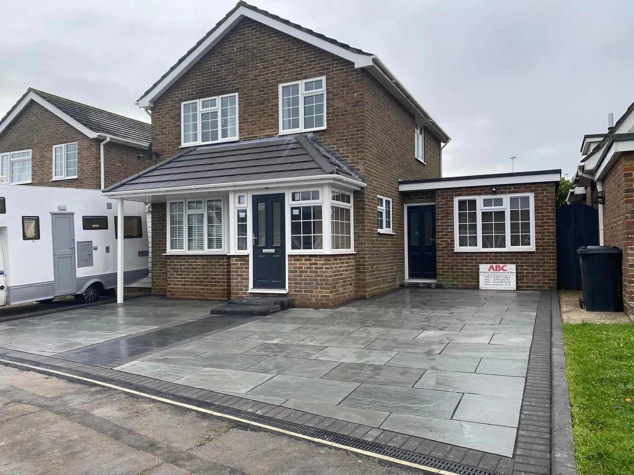 Front extension with new porch and slate paved driveway by A Baker Construction West Sussex