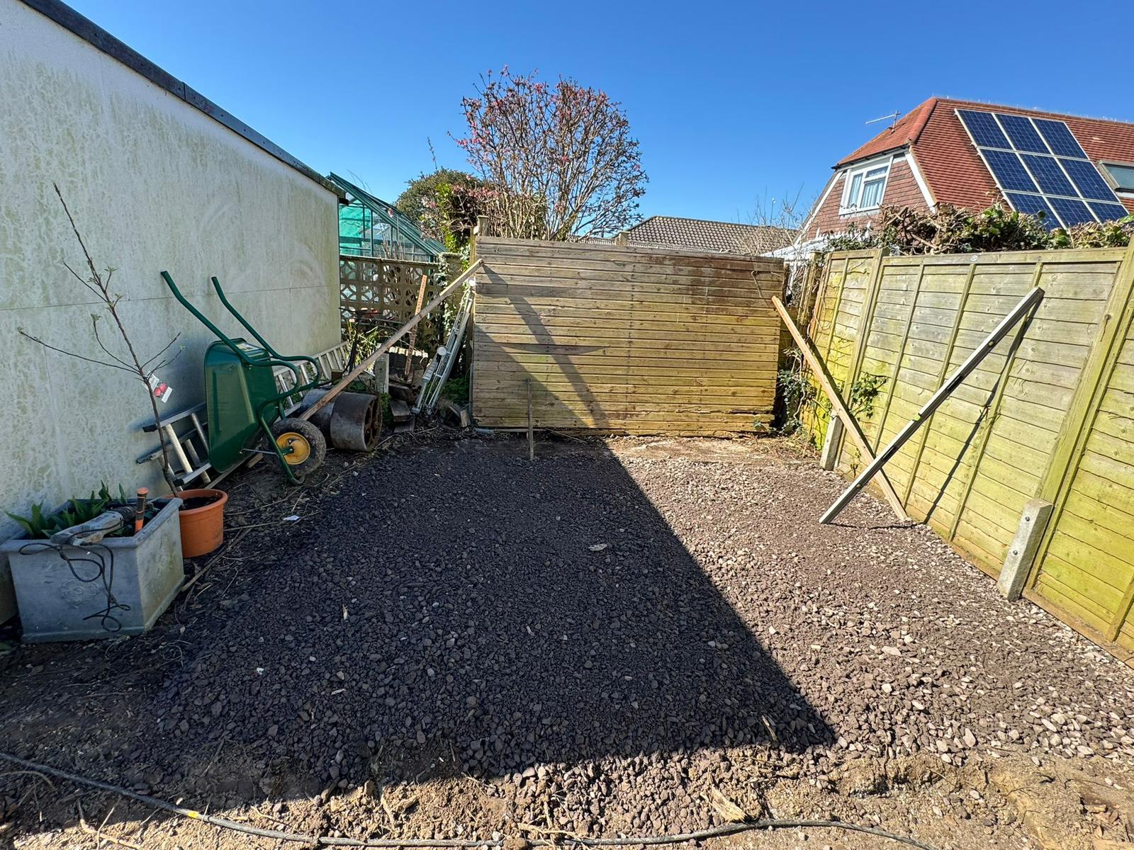 Patio slabs being laid with raised planting beds West Sussex