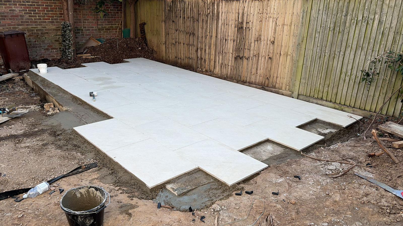 Stepping stone path layout marked out during garden renovation West Sussex